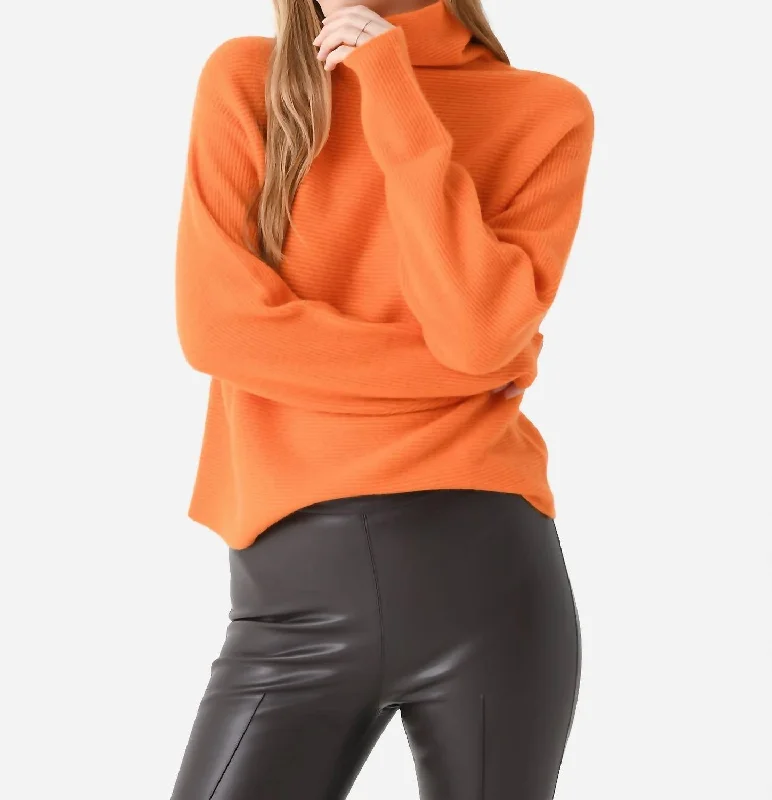 Get noticed with eye-catching women’s fashion   Leland Sweater In Tangerine